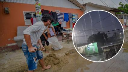 Habitantes del barrio El Pasito, de Soledad, limpian sus viviendas afectadas por las lluvias.